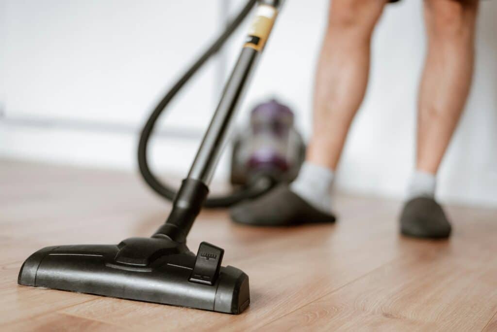 Cleaning & Maintaining Vinyl Flooring in Your Living Room: A Simple Guide_WoodOrigins_Vacuum1