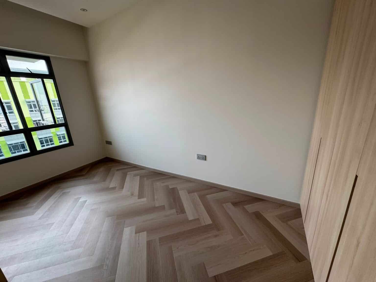 Carrera Oak IN 04 herringbone vinyl flooring in a bedroom, 216 Tampines Road