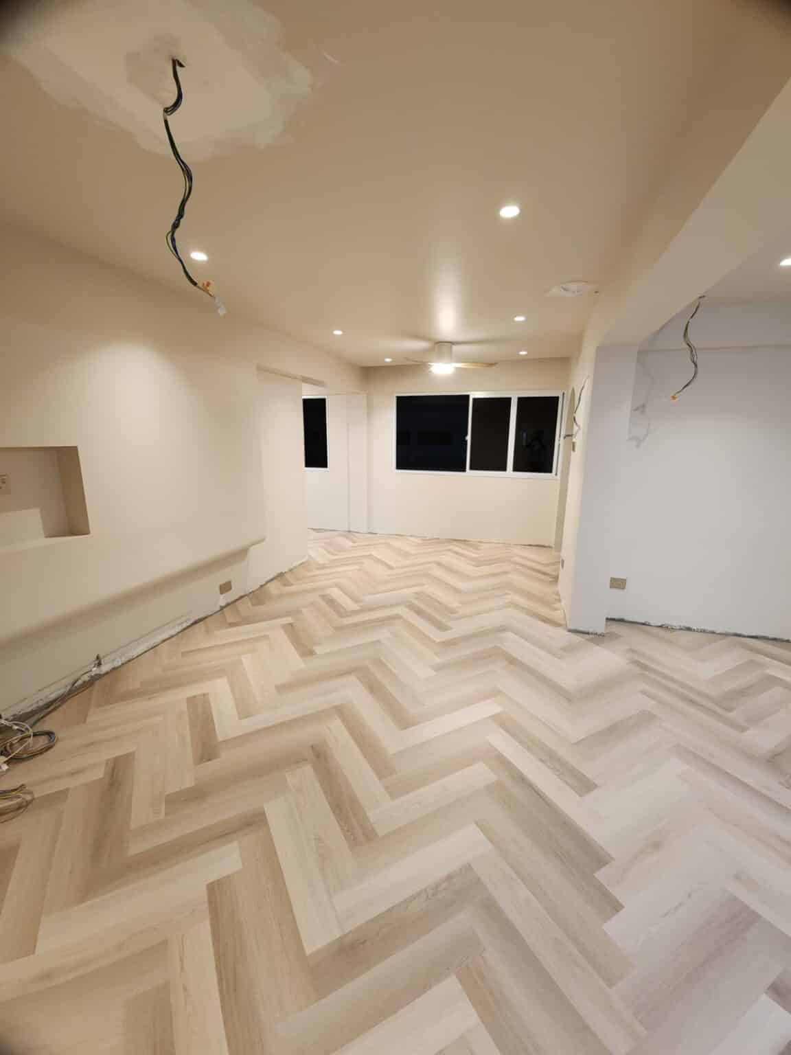 Carrera Oak IN 04 herringbone vinyl flooring in a living room