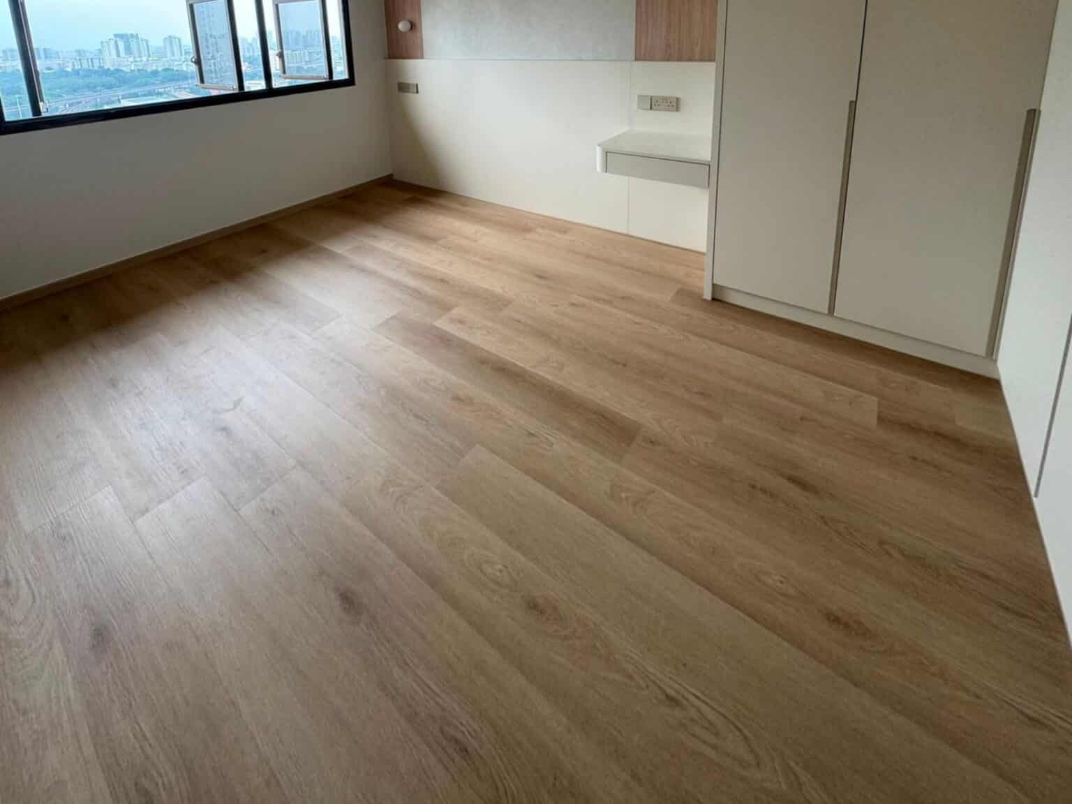 Cypress Oak vinyl flooring in a bedroom with a window view