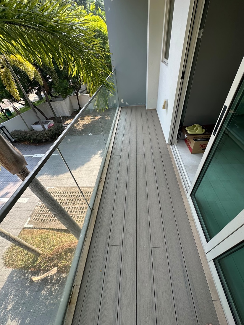Composite decking along a balcony walkway