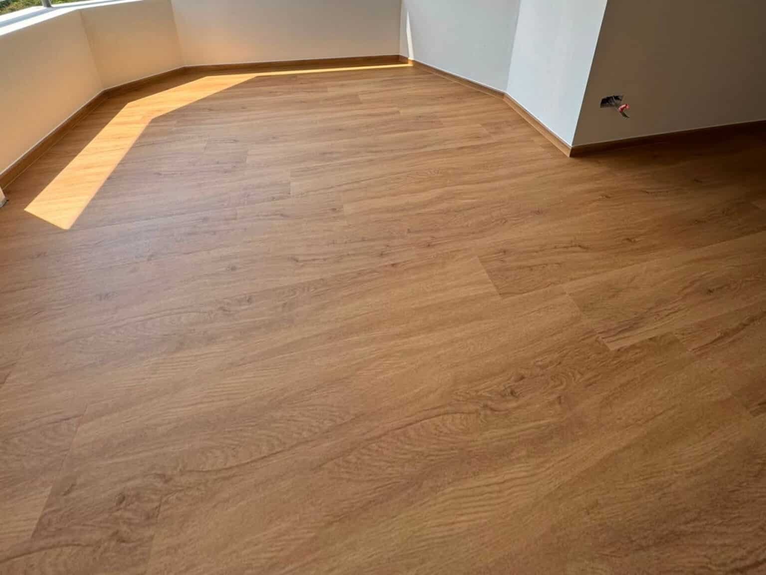 Moonbeam Oak vinyl flooring on a sunlit balcony