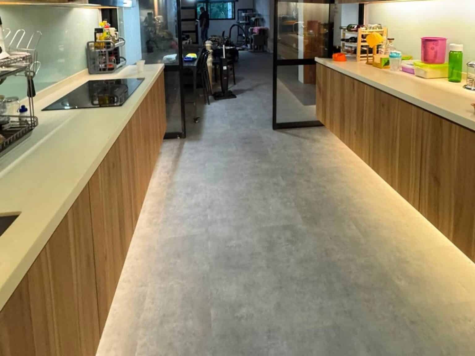 Portland Grey stone-look vinyl tile in a galley kitchen
