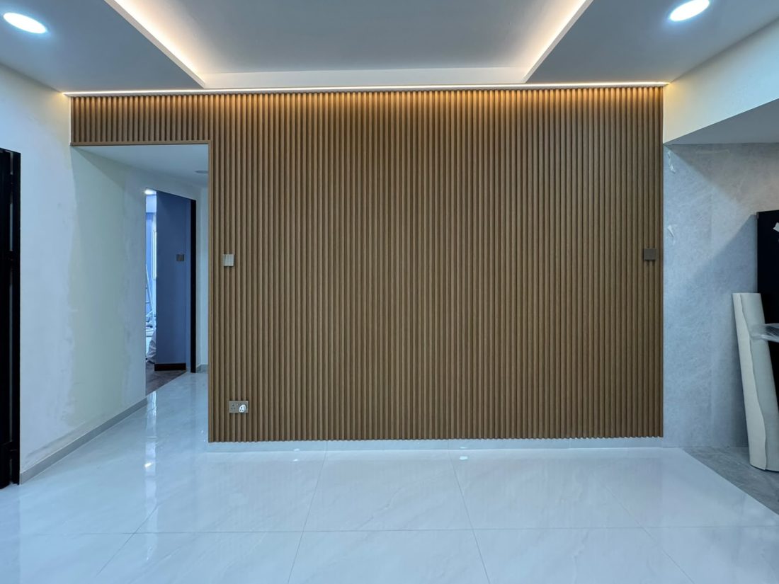 Chestnut fluted panel feature wall with LED cove lighting