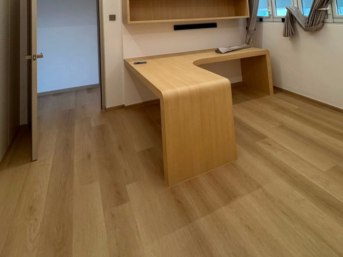 Danube Oak vinyl flooring in a study with built-in desk and cabinets
