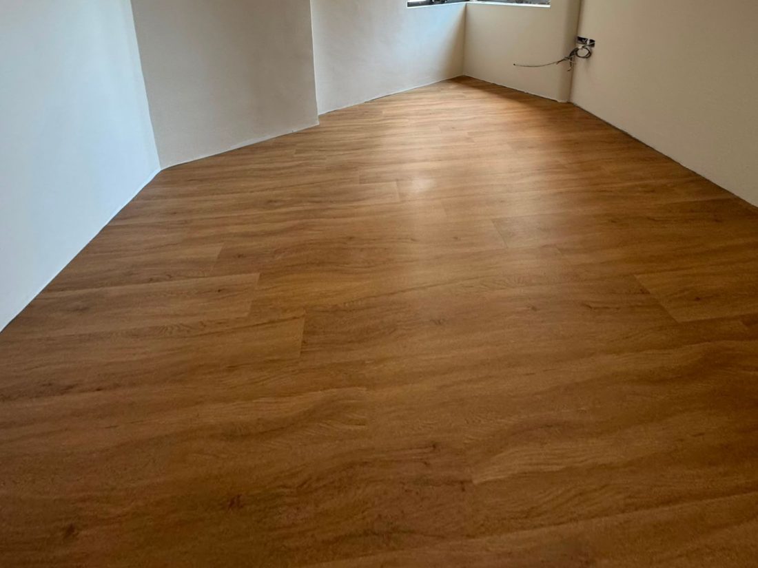 Moonbeam Oak vinyl flooring in a bedroom